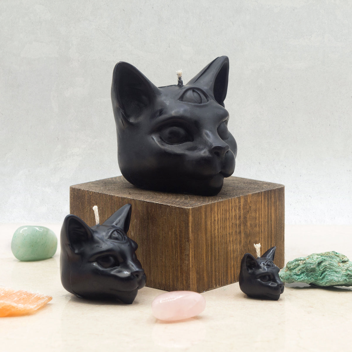 Set of three different sized mystical black cat candles, small, medium and large